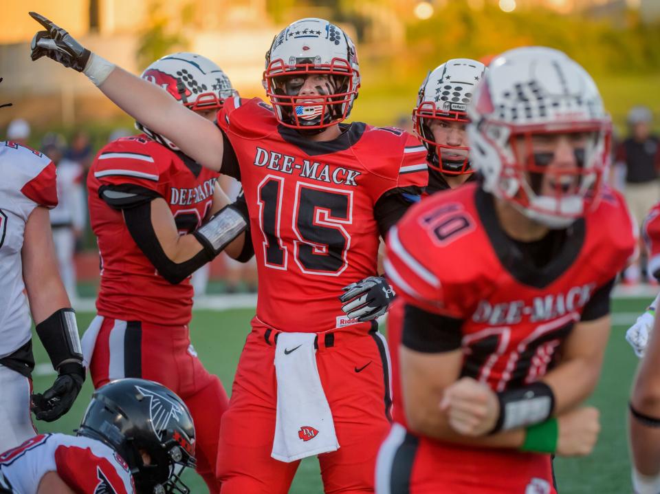 Dee-Mack's Carson Cassady (15) indicates that the Chiefs took possession after a fumble in the first half of their Week 2 football game Friday, Sept. 1, 2023 in Mackinaw.
