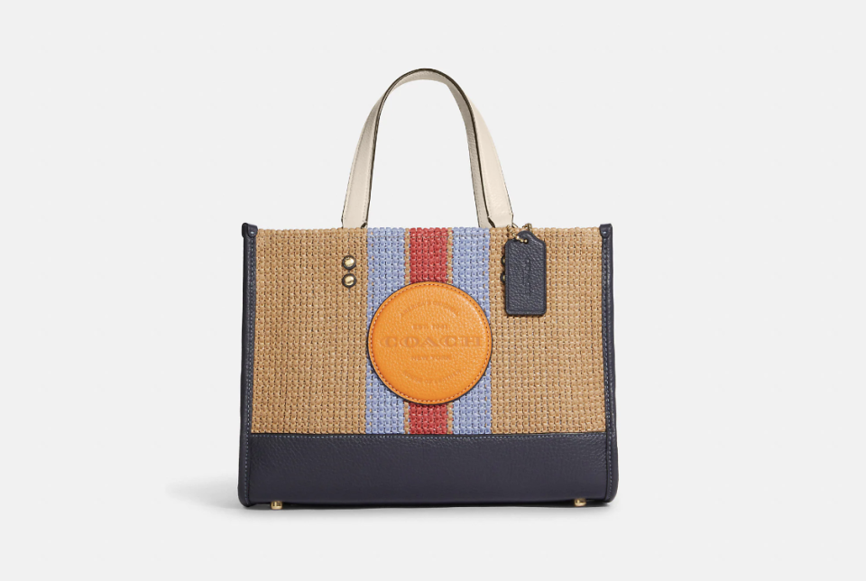 Coach Outlet Dempsey Carryall in natural multi (Photo via Coach Outlet)
