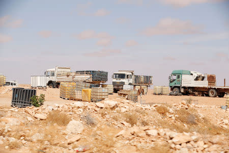 A view shows a truck loaded with empty fuel containers at the edge of Remada town south Tunisia, October 12, 2018. Picture taken October 12, 2018. REUTERS/Zoubeir Souissi