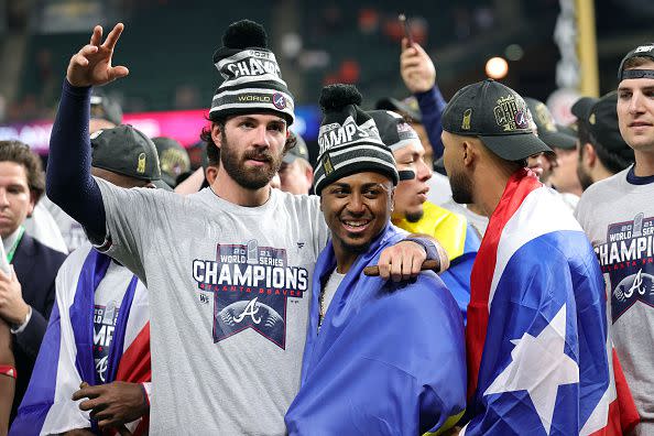 HOUSTON, TEXAS - NOVEMBER 02:  Dansby Swanson #7 of the Atlanta Braves celebrates with Ozzie Albies #1 after their 7-0 victory against the Houston Astros in Game Six to win the 2021 World Series at Minute Maid Park on November 02, 2021 in Houston, Texas. (Photo by Carmen Mandato/Getty Images)