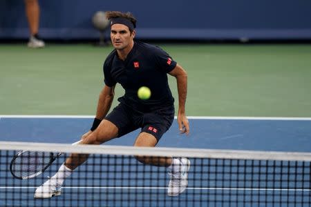 Aug 18, 2018; Mason, OH, USA; Roger Federer (SUI) returns a shot against David Goffin (BEL) in the Western and Southern tennis open at Lindner Family Tennis Center. Mandatory Credit: Aaron Doster-USA TODAY Sports