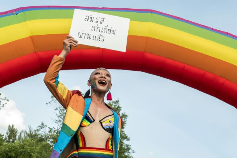 A member of the LGBTQ community celebrates after the Thai parliament passed the final senatorial vote on the same sex marriage bill in Bangkok on June 18, 2024 (Chanakarn Laosarakham)