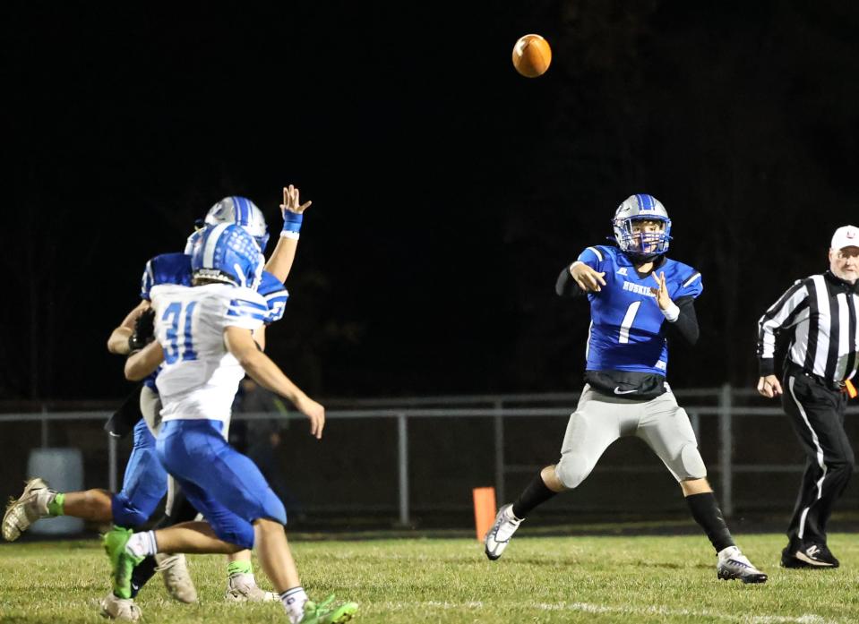 Northwestern quarterback Ethan Siders fires this pass while scrambling.