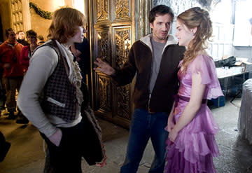 <p>Rupert Grint as Ron Weasley, producer David Heyman and Emma Watson as Hermione Granger on the set of Warner Bros. Pictures' Harry Potter and the Goblet of Fire - 2005</p>