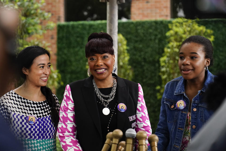 The Rev. Bernice King, center, daughter of the Rev. Martin Luther King Jr. and Coretta Scott King, granddaughter of Rev. Martin Luther King Jr., Yolanda Renee King, right, and artist Saya Woolfalk, left, attend the dedication of the Coretta Scott King Peace and Meditation Garden and monument on Thursday, April 27, 2023, in Atlanta. (AP Photo/Brynn Anderson)