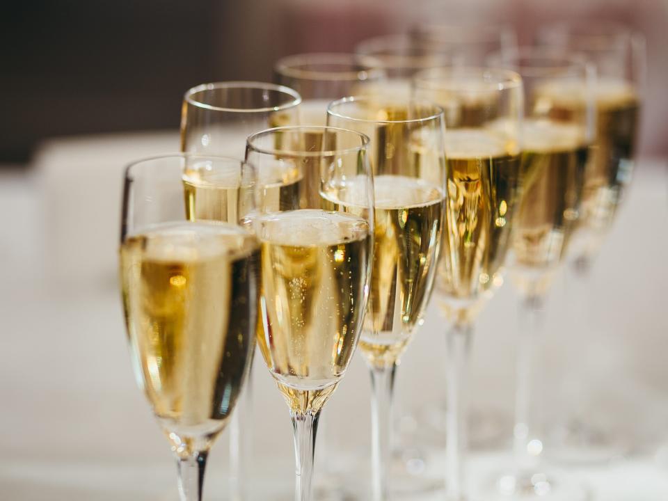 a row of glasses of champagne