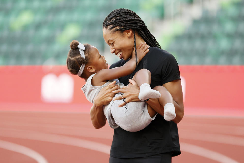 EUGENE, OREGON - JUNE 26: Allyson Felix celebrates with her daughter Camryn after day nine of the 2020 U.S. Olympic Track & Field Team Trials at Hayward Field on June 26, 2021 in Eugene, Oregon. (Photo by Steph Chambers/Getty Images)