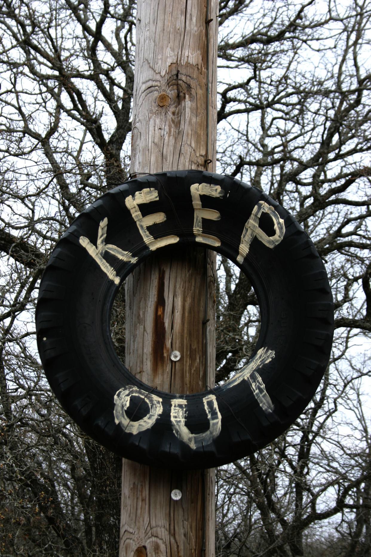 keep out tire sign in luther