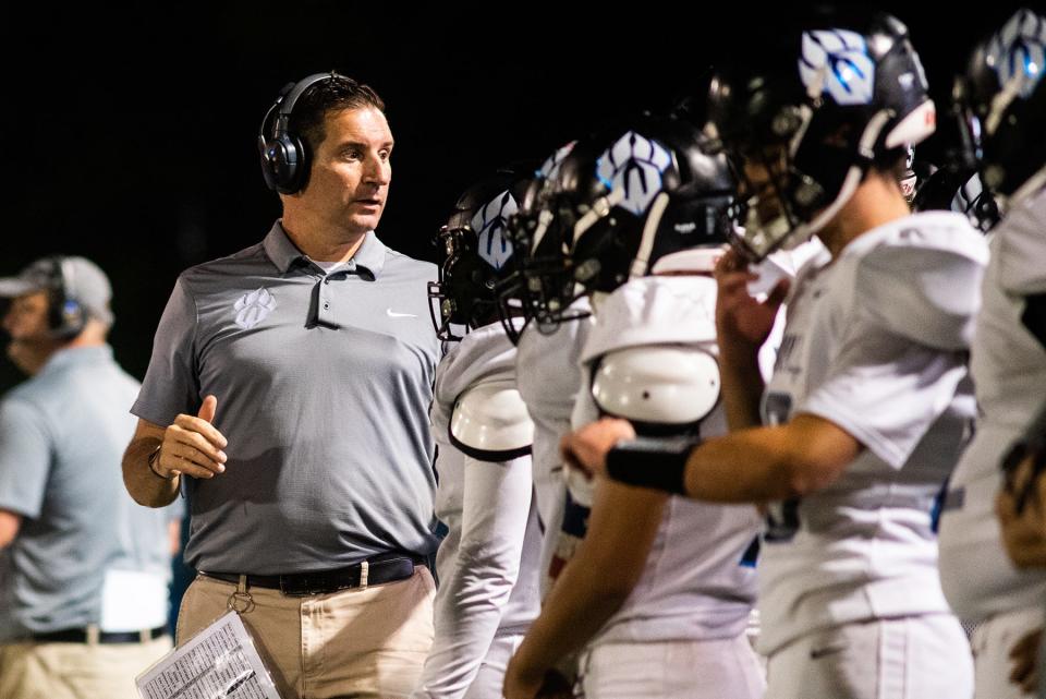 Wallkill head coach Brian Vegliando talks to players on the sideline during the Section 9 football game at Faller Field in Middletown, NY on Friday, September 17, 2021. Middletown defeated Wallkill.