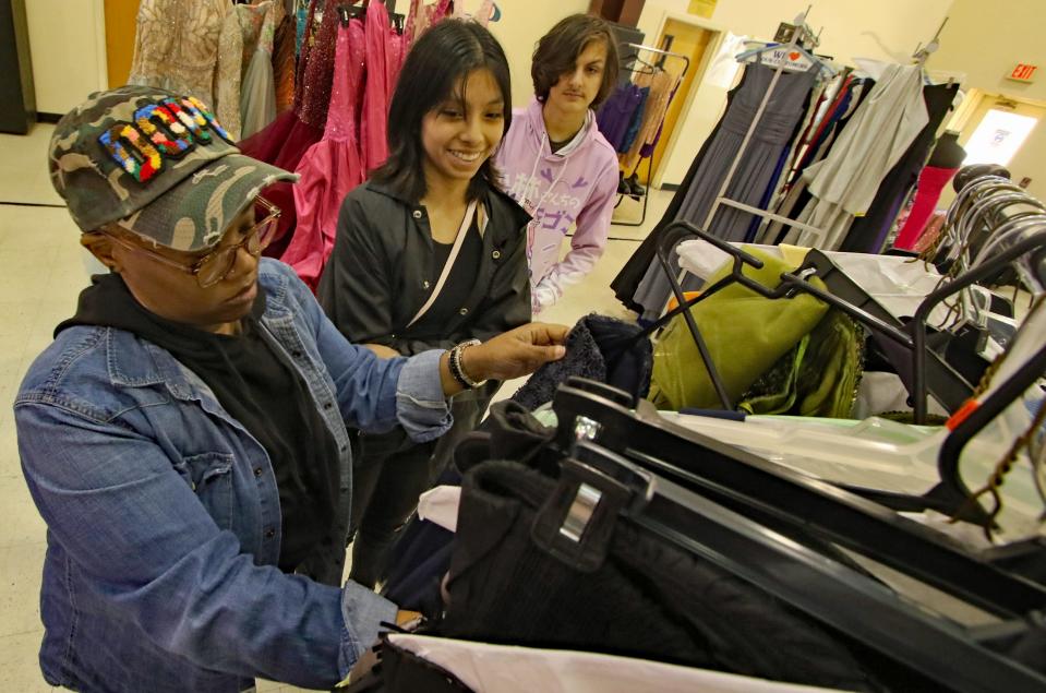 Cleveland Early College students Jessica Trejo and Daniel Willis are helped by Tanya Hardin during the Girl Talk Ministry 2nd Annual Prom Dress Giveaway held Saturday, March 18, 2023, at Bynum Chapel Family Life Center in Kings Mountain.