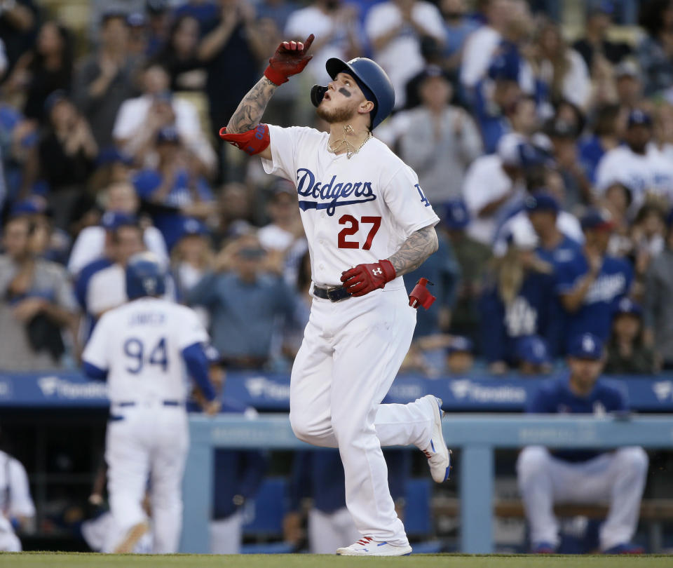 Los Angeles Dodgers' Alex Verdugo points skyward after hitting a solo home run against the Chicago Cubs during the fourth inning of a baseball game in Los Angeles, Saturday, June 15, 2019. (AP Photo/Alex Gallardo)