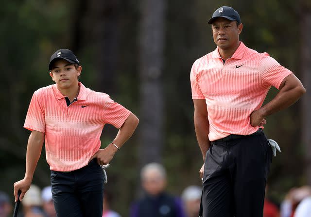 David Cannon/Getty Tiger Woods and his son Charlie Woods wait to putt on the third hole during the first round of the 2022 PNC Championship.