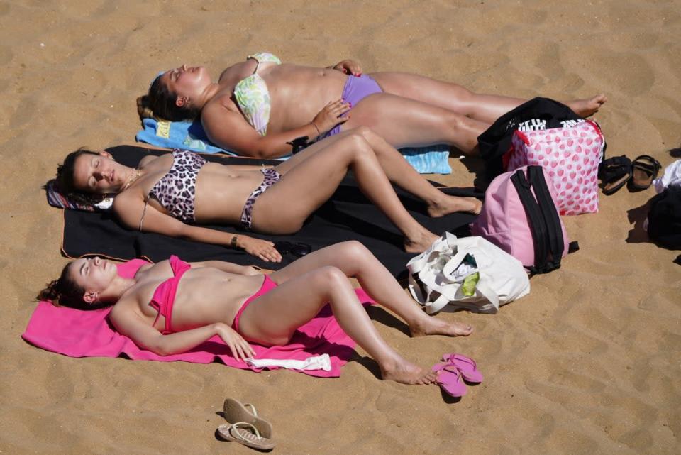 Sunbathers enjoy the hot weather at the beach in Broadstairs, Kent (Gareth Fuller/PA) (PA Wire)