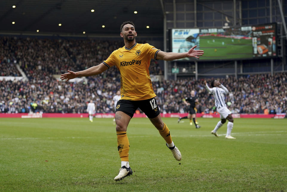 Wolverhampton Wanderers' Matheus Cunha celebrates scoring his sides second goal of the game, during the English FA Cup fourth round soccer match between West Bromwich Albion and Wolverhampton Wanderers, at The Hawthorns, in West Bromwich, England, Sunday, Jan. 28, 2024. (Bradley Collyer/PA via AP)