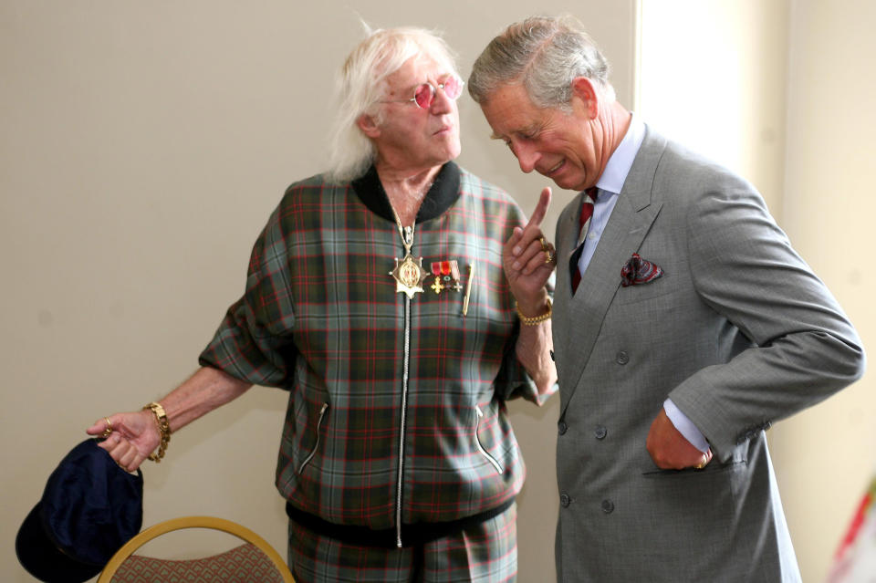 Prince Charles meets Sir Jimmy Savile during his visit to Scarborough.   (Photo by Gareth Copley - PA Images/PA Images via Getty Images)