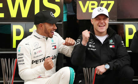 Formula One F1 - Spanish Grand Prix - Circuit de Barcelona-Catalunya, Barcelona, Spain - May 13, 2018 Mercedes’ Lewis Hamilton and Valtteri Bottas celebrate after finishing first and second respectively REUTERS/Albert Gea