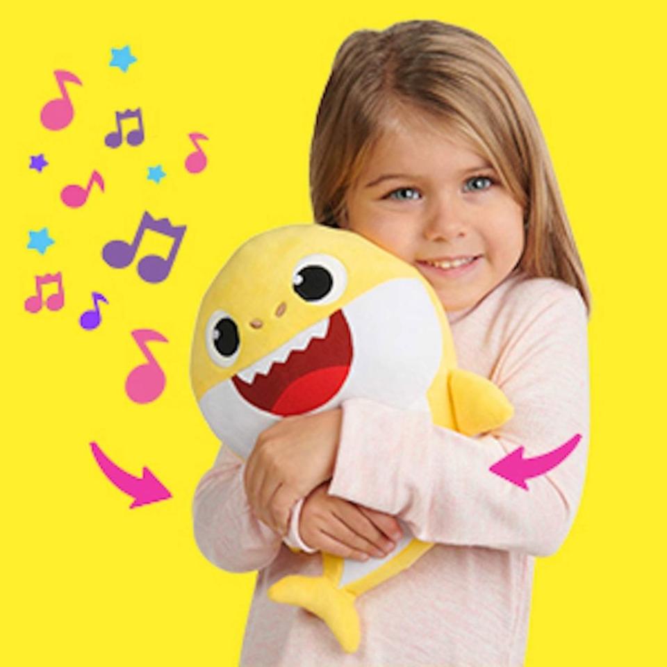 Child with WowWee Pinkfong Baby Shark Official Song Dolls