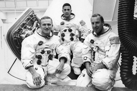 Apollo 8 crew members Frank Borman (left), Bill Anders and Jim Lovell, posing outside their command module in 1968.