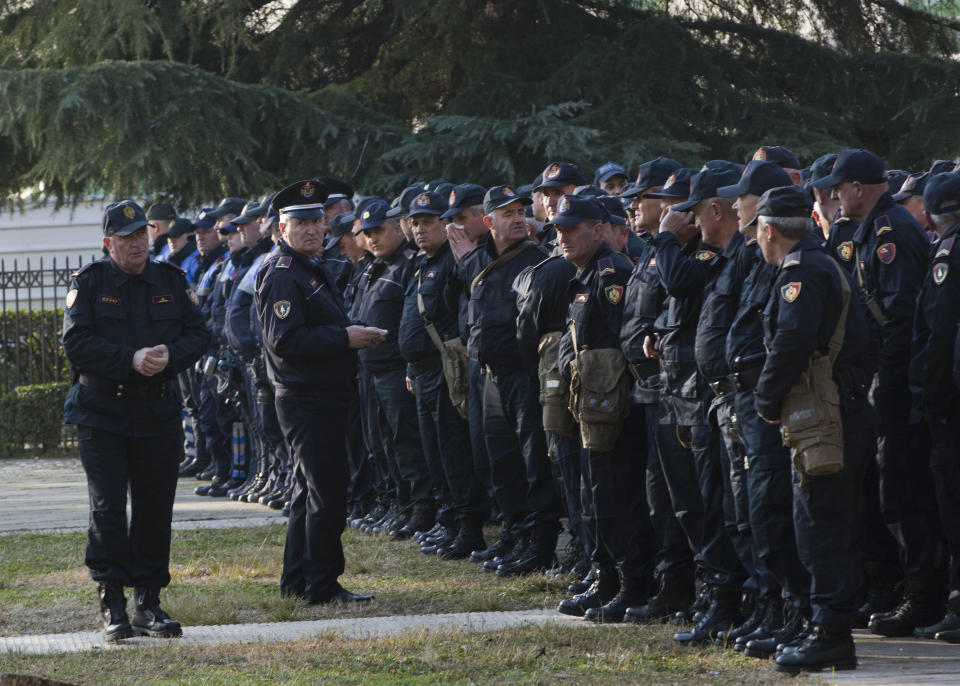 Policemen prepare to secure the Parliament building as opposition supporters gather to participate in an anti-government rally in capital Tirana, Albania, on Tuesday, Feb. 21, 2019. Albania’s opposition supporters have surrounded the parliament building Thursday, asking for the resignation of the government which they allege is corrupt. (AP Photo/Visar Kryeziu)