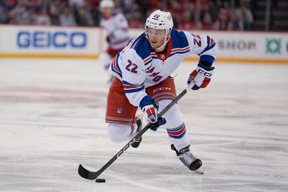 New York Rangers center Jonny Brodzinski skates with puck during the first period of the team's NHL hockey game against the New Jersey Devils on Thursday, Feb. 22, 2024, in Newark, N.J.