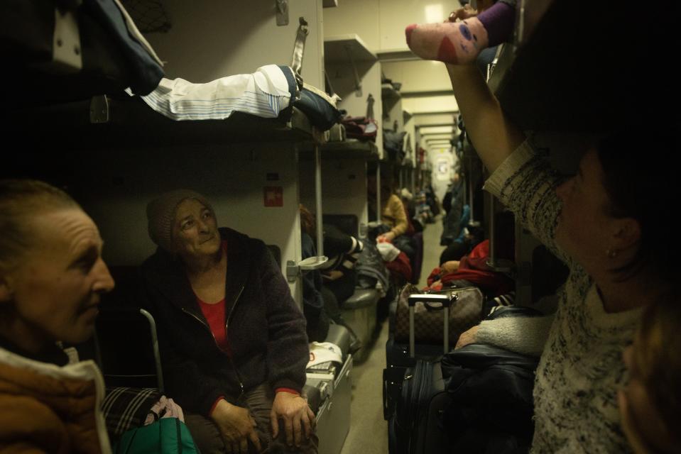 People wait on board an evacuation train to leave the station in Kherson, Ukraine (Getty Images)