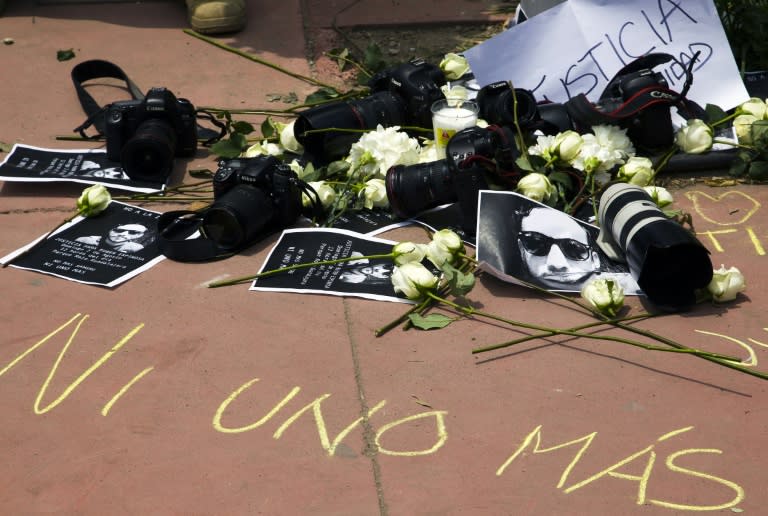 Signs, cameras and flowers are seen during a demonstration to demand justice in the murder of Mexican photojournalist Ruben Espinosa in Guadalajara City, on August 2, 2015