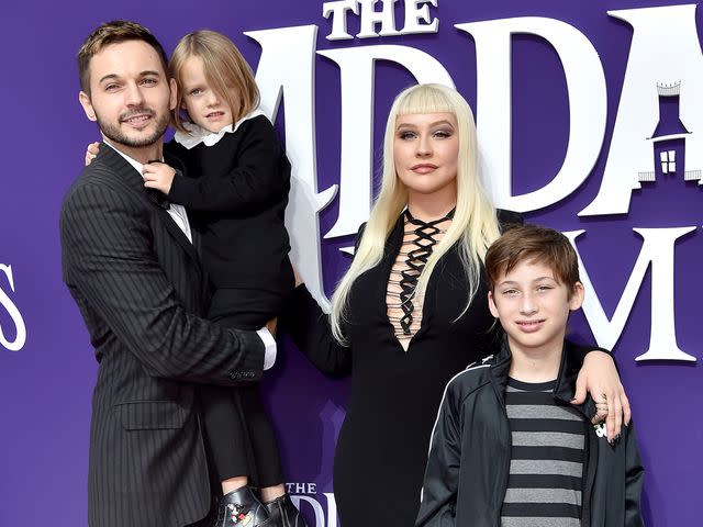 Axelle/Bauer-Griffin/FilmMagic Christina Aguilera with her husband, Matthew Rutler, and her kids, Max Bratman and Summer Rain Rutler, attend the premiere of 'The Addams Family' in October 2019 in Los Angeles.