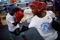 Children practice during an exercise session at a boxing school, in the Mare favela of Rio de Janeiro, Brazil, June 2, 2016. REUTERS/Nacho Doce