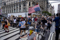 Activists move along W. 34th Street, Saturday, June 6, 2020, in New York. Protests continued following the death of George Floyd who died after being restrained by Minneapolis police officers on May 25. (AP Photo/Craig Ruttle)
