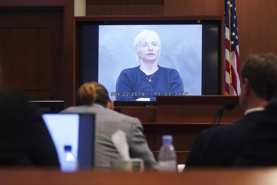 Actor Ellen Barkin testifies in a previously recorded video deposition at the Fairfax County Circuit Courthouse in Fairfax, Va., Thursday, May 19, 2022. Actor Johnny Depp sued his ex-wife Amber Heard for libel in Fairfax County Circuit Court after she wrote an op-ed piece in The Washington Post in 2018 referring to herself as a "public figure representing domestic abuse." (Shawn Thew/Pool Photo via AP)