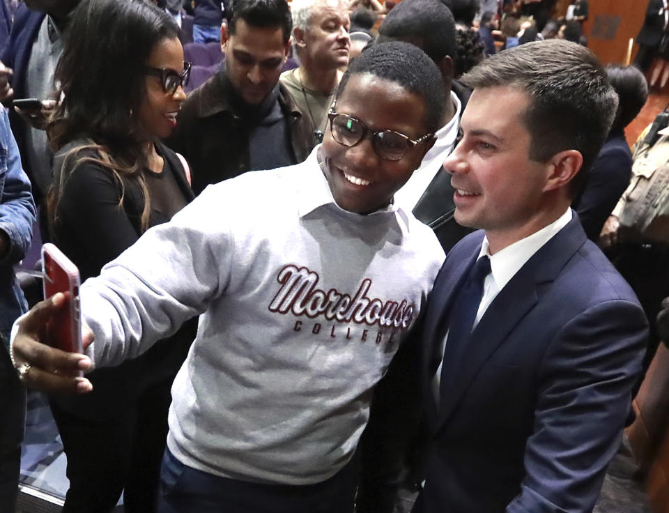 Morehouse College student Keron Campbell snaps a selfie with presidential hopeful Pete Buttigieg, Mayor of South Bend, Ind., at Morehouse College on Monday, Nov. 18, 2019, in Atlanta. (Curtis Compton/Atlanta Journal-Constitution via AP)