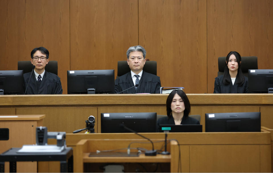 Presiding Judge Keisuke Masuda (top, C) of Kyoto District Court and others attend a courtroom where defendant Shinji Aoba's sentencing hearing in Kyoto on January 25, 2024. A Japanese court found guilty on January 25 the perpetrator of a 2019 arson attack on an animation studio that killed 36 people, with sentencing expected later in the day, local media reported. (Photo by JIJI Press / AFP) / Japan OUT (Photo by STR/JIJI Press/AFP via Getty Images)