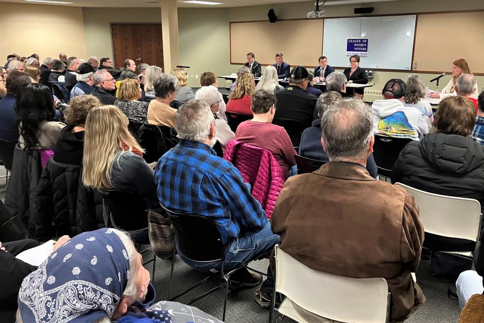 More than 100 people attend the Menasha mayor forum Thursday at the Menasha Public Library.