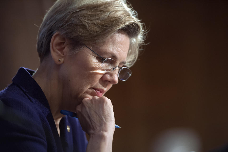 FILE - In this March 7, 2013 file photo, Sen. Elizabeth Warren, D-Mass., pauses while questioning a witness at Senate Banking Committee hearing on anti-money laundering on Capitol Hill in Washington. As she enters her second year in Congress in 2014, Warren told The Associated Press she's focused on improving the economic futures of American families by reigning in student debt, easing what she calls the nation's retirement crisis, and doubling funding for federal research programs. (AP Photo/Cliff Owen, File)