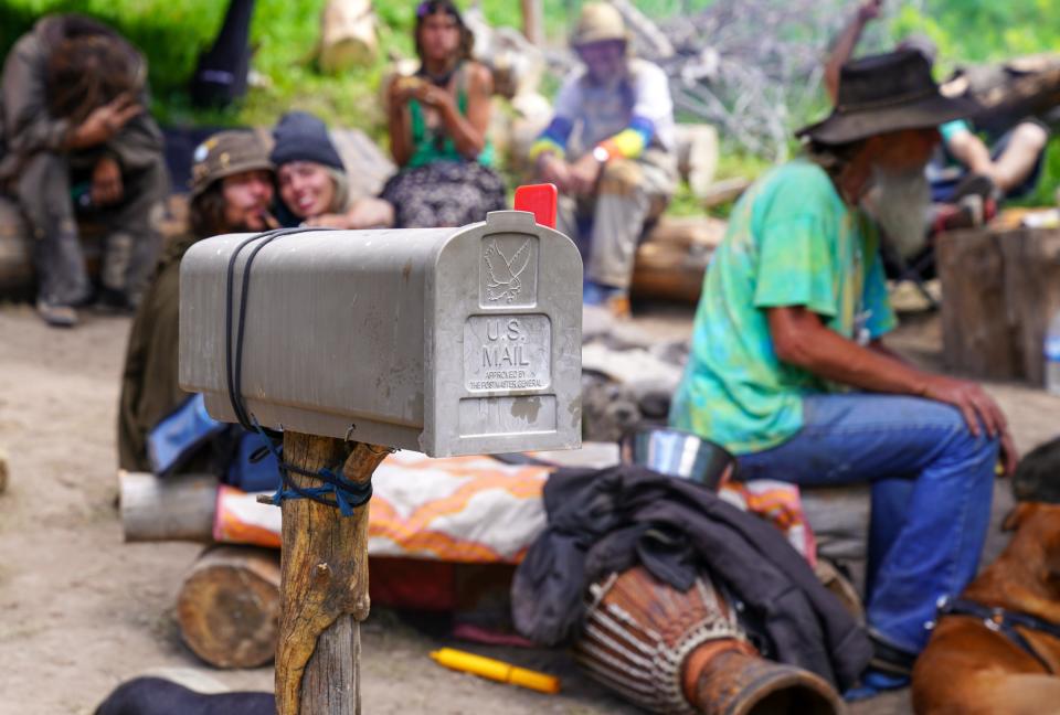 A mailbox filled with marijuana sits outside a camp at the Rainbow Family gathering on June 26. Marijuana is legal in Colorado but is banned on federal forest lands, so campers put the marijuana inside the mailbox because they believe that only postal inspectors can open it without a warrant.