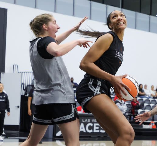 <p>Ethan Miller/Getty</p> A'ja Wilson (R) #22 of the Las Vegas Aces drives against Kate Martin #20 of the Aces during a training camp scrimmage