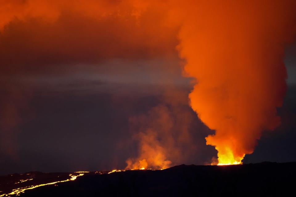 Lava erupts from Hawaii’s Mauna Loa volcano on Nov. 30, 2022, near Hilo, Hawaii. (AP Photo/Gregory Bull)