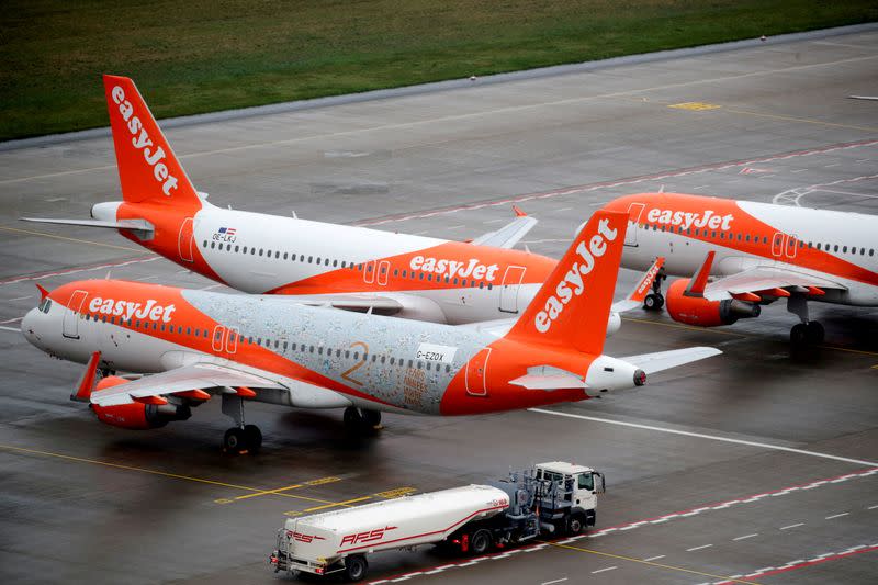 FILE PHOTO: EasyJet airplanes are parked on the tarmac during the official opening of the new Berlin-Brandenburg Airport (BER) "Willy Brandt", in Schoenefeld near Berlin