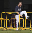 Atlanta Braves pitcher A.J. Minter does an agility drill at baseball spring training practice in North Port, Fla., Friday, Feb. 14, 2020. (Curtis Compton/Atlanta Journal-Constitution via AP)