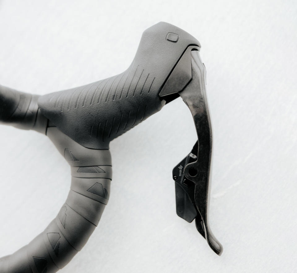 closeup of bonus button on new SRAM RED AXS 2x road group brake levers.