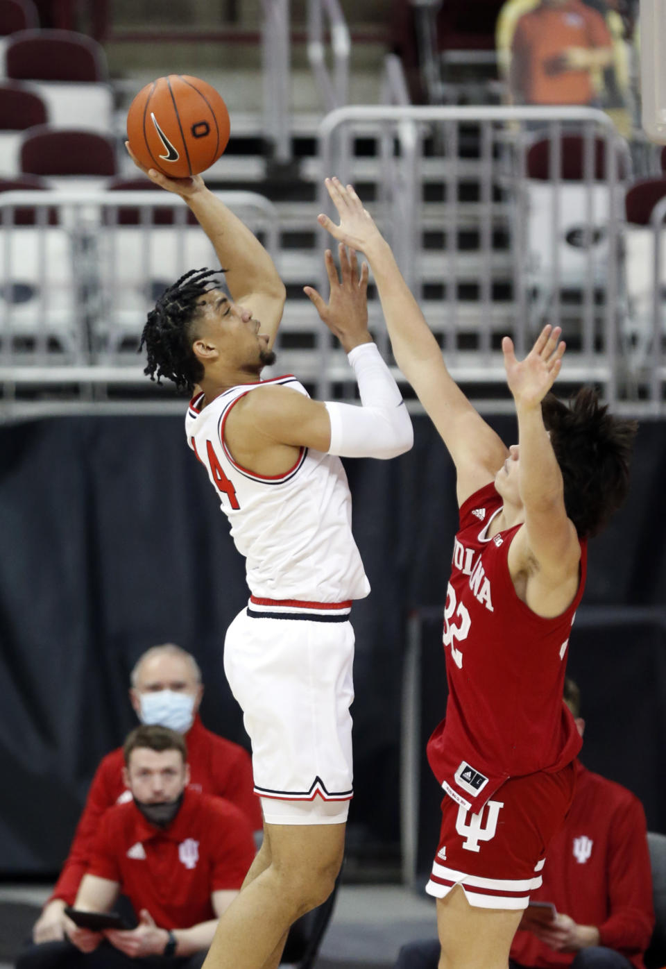 Ohio State forward Justice Sueing, left, goes up for a shot against Indiana guard Trey Galloway during the first half of an NCAA college basketball game in Columbus, Ohio, Saturday, Feb. 13, 2021. (AP Photo/Paul Vernon)