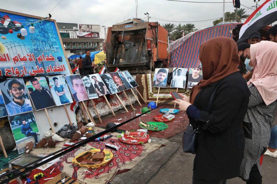 Posters of protesters who have been killed in demonstrations and their belongings are displayed in Tahrir Square during ongoing anti-government protests in Baghdad, Iraq, Tuesday, Dec. 3, 2019. At least 400 people have died since the leaderless uprising shook Iraq on Oct. 1, with thousands of Iraqis taking to the streets in Baghdad and the predominantly Shiite southern Iraq decrying corruption, poor services, lack of jobs and calling for an end to the political system that was imposed after the 2003 U.S. invasion. (AP Photo/Hadi Mizban)