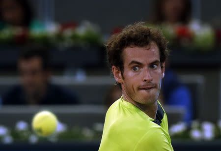 Andy Murray of Britain eyes the ball before returning it to Nicolas Almagro of Spain during their match at the Madrid Open tennis tournament May 7, 2014. REUTER/Susana Vera