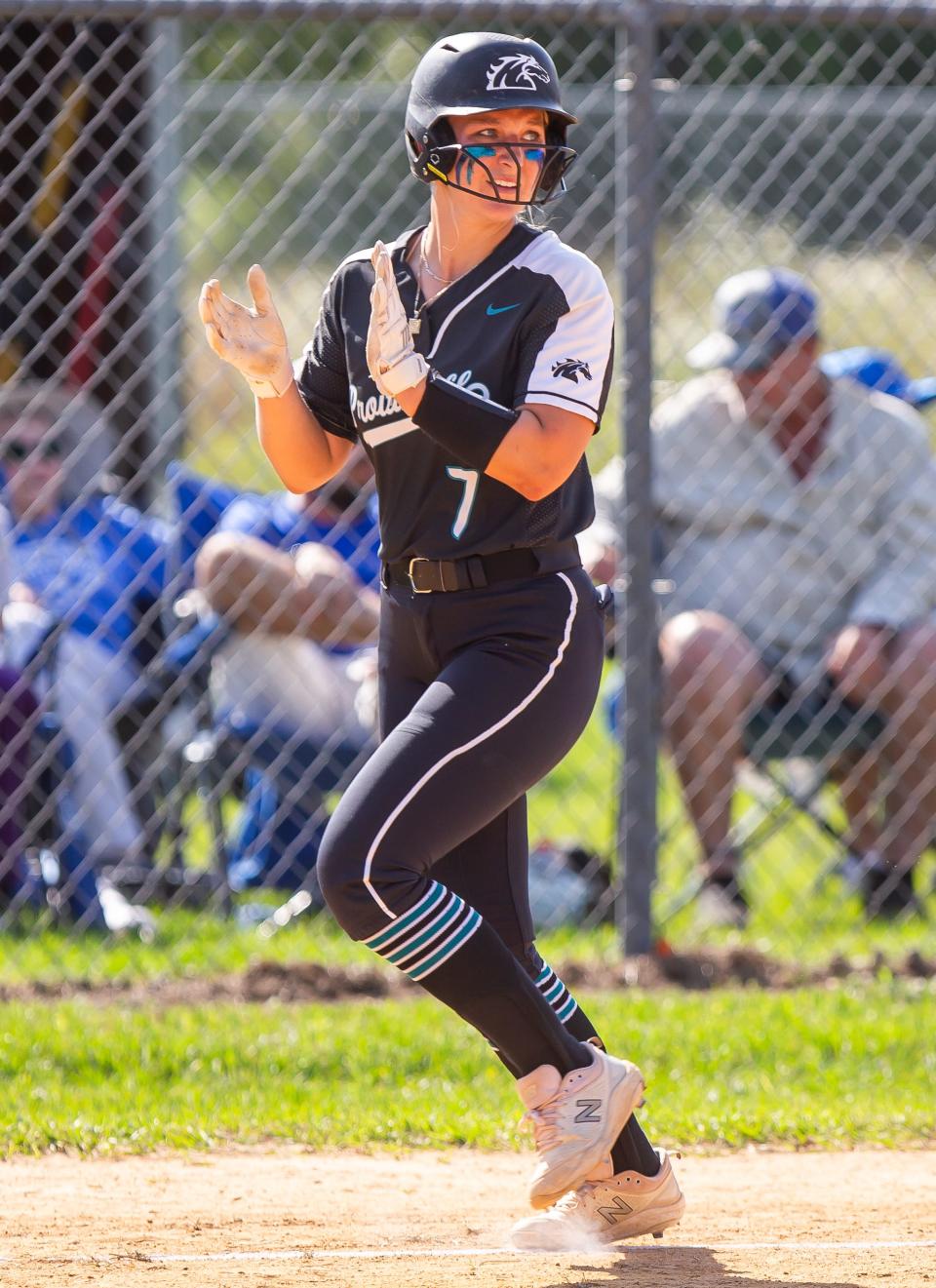 Providence's Summer Stearns (7) applauds after a three-run homer by teammate Elle Burns in the Region 1-2A quarterfinals.