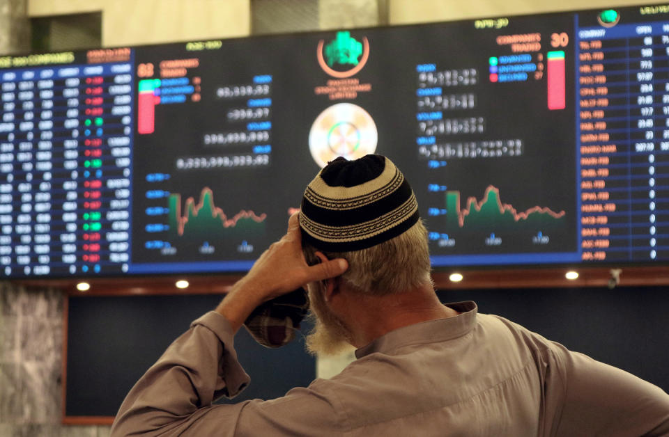 A Pakistani stockbroker monitors the latest share prices during a trading session at the Pakistan Stock Exchange in Karachi, Pakistan, on Feb. 10. The sluggish performance of the market was attributed to the delay in concluding the ninth review of a $7 billion US dollar IMF loan program.<span class="copyright">Rehan Khan—EPA-EFE/Shutterstock</span>