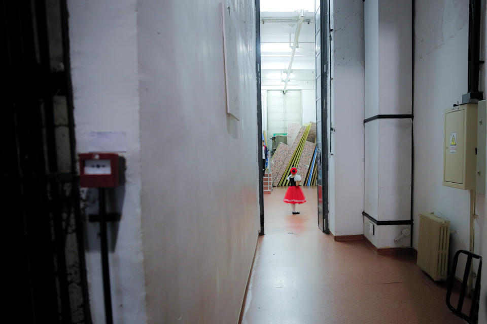 In this Dec. 3, 2019, photograph a ballerina of the Arabesque Children's Ballet Ensemble, waits backstage before performing during a show featuring children with Down syndrome, in Bucharest, Romania. Children with Down syndrome staged a fashion show and performed along a ballet ensemble, two milestone events for the inclusion of people with disabilities in Romania's social life, 30 years after the fall of communism following a violent uprising at the end of 1989.(AP Photo/Vadim Ghirda)