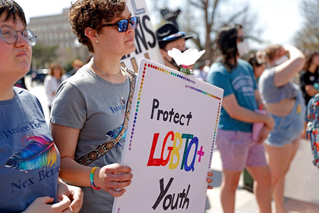 Kali Eernisse holds a sign during a march for Nex Benedict at the state Capitol in Oklahoma City, Thursday, March 14, 2024. Benedict was pronounced dead Feb. 8, one day after being injured in an altercation inside an Owasso High School bathroom.