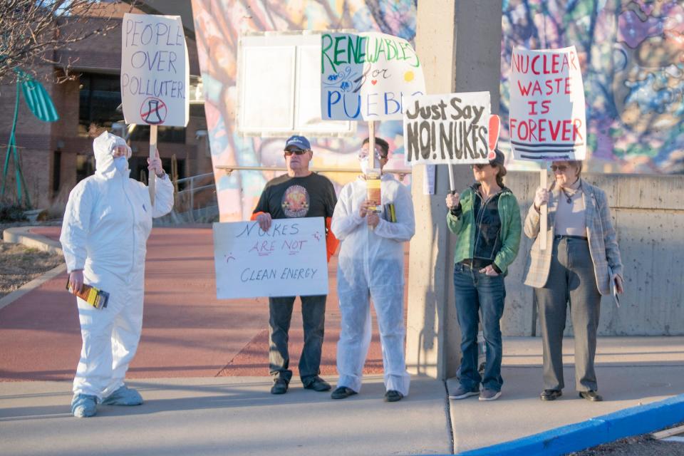Anti-nuclear energy protesters hold signs outside the Sangre de Cristo Arts Center before a town hall meeting regarding the future of nuclear energy in Pueblo on Thursday, February 29, 2024.