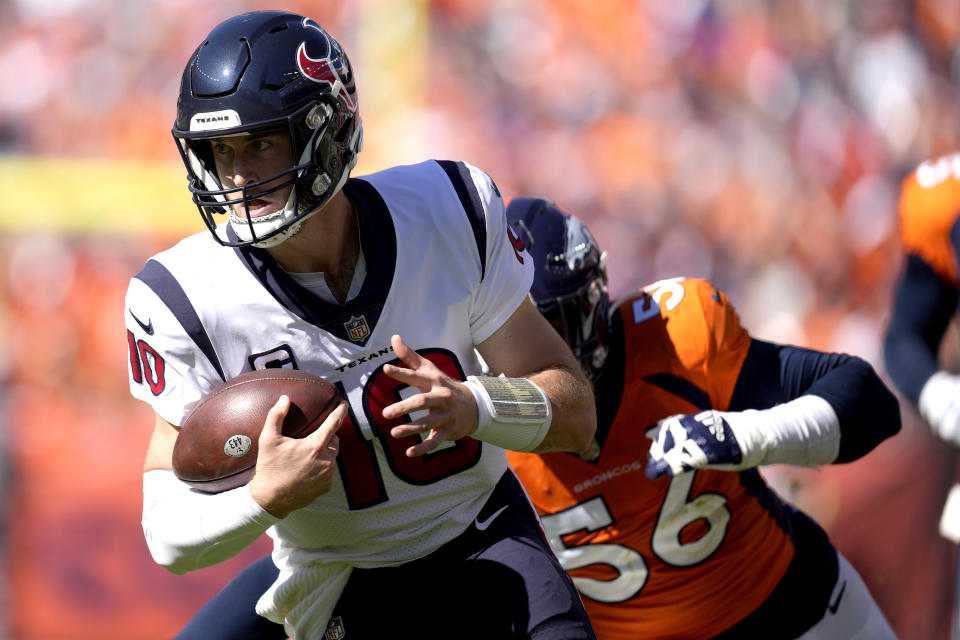 Houston Texans quarterback Davis Mills (10) scrambles as Denver Broncos linebacker Baron Browning (56) pursues during the first half of an NFL football game, Sunday, Sept. 18, 2022, in Denver. (AP Photo/David Zalubowski)