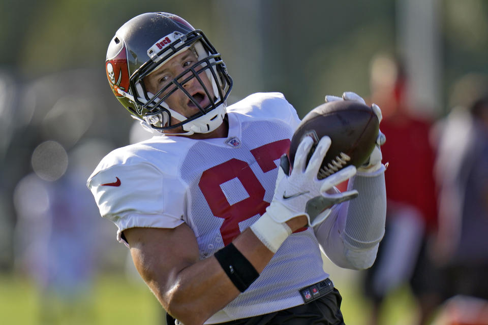 Tampa Bay Buccaneers tight end Rob Gronkowski (87) makes a catch on a pass from quarterback Tom Brady during an NFL football training camp practice Monday, Aug. 24, 2020, in Tampa, Fla. (AP Photo/Chris O'Meara)